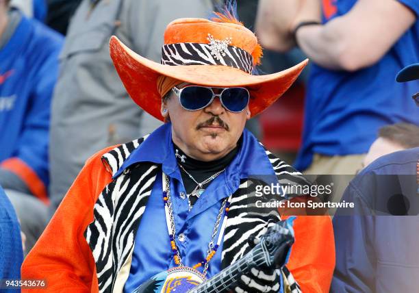 Boise State Broncos fan plays an air guitar during the second half of the Las Vegas Bowl game between the Boise State Broncos and the Oregon Ducks on...