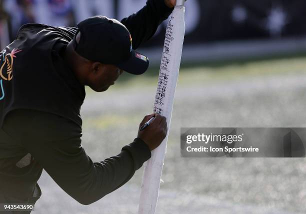 Chain crewmember manages a signal pole on the sidelines during the first half of the Las Vegas Bowl Saturday, Dec. 16 in Las Vegas. The Boise State...