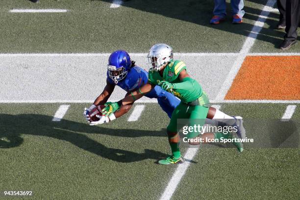 Boise State wide receiver A.J. Richardson tries to pull in a catch that was later overturned during the Las Vegas Bowl featuring the Oregon Ducks and...