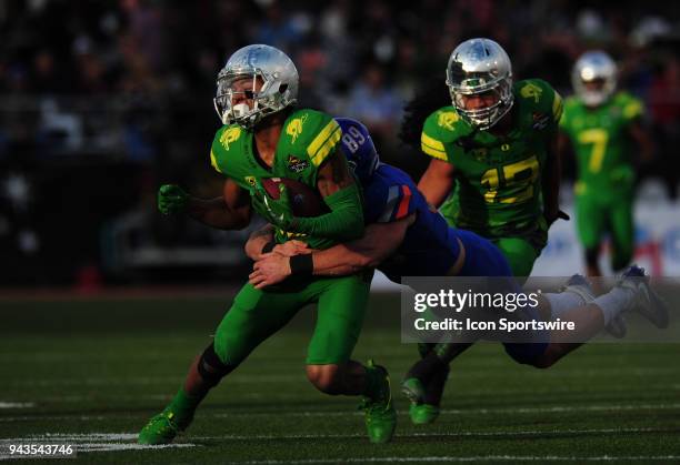 Boise State Broncos wide receiver Brock Barr tackles Oregon Ducks punt returner Dillon Mitchell in the second half of the 2017 Las Vegas Bowl at Sam...