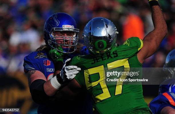 Boise State Broncos offensive lineman Garrett Larson blocks Oregon Ducks defensive lineman Jalen Jelks in the second half of the 2017 Las Vegas Bowl...