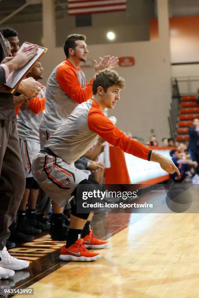 Bowling Green guard Ethan Good signals that the shot counts plus one during a game between the Bowling Green State University Falcons and Lourdes...