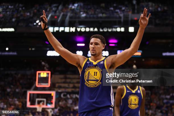 Klay Thompson of the Golden State Warriors reacts during the first half of the NBA game against the Phoenix Suns at Talking Stick Resort Arena on...