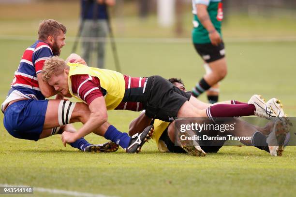 Geoff Parling is tackled by Matt Philp during a Melbourne Rebels Super Rugby training session on April 9, 2018 in Melbourne, Australia.