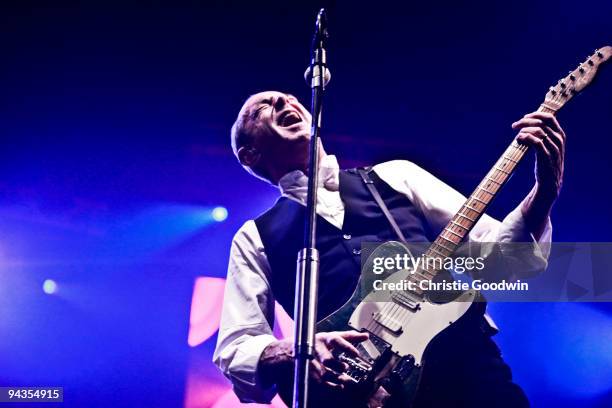 Francis Rossi of Status Quo performs on stage at Wembley Arena on December 12, 2009 in London, England.