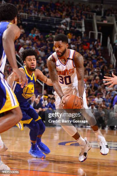 Troy Daniels of the Phoenix Suns handles the ball during the game against Quinn Cook of the Golden State Warriors on April 8, 2018 at Talking Stick...