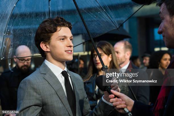 Tom Holland gives an interview to the media at 'Avengers: Infinity War' UK fan event at Television Studios in White City in London. April 08, 2018 in...