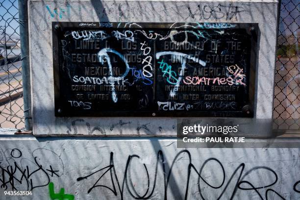 Placard marking the dividing line of the US-Mexico Border is pictured on the Cordova Americas Bridge between El Paso, Texas and Ciudad Juarez,...