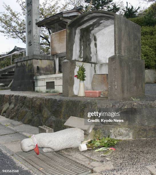 Roadside Buddhist statue is seen collapsed in Oda, Shimane Prefecture after a magnitude 6.1 earthquake hit the western Japanese prefecture on the...