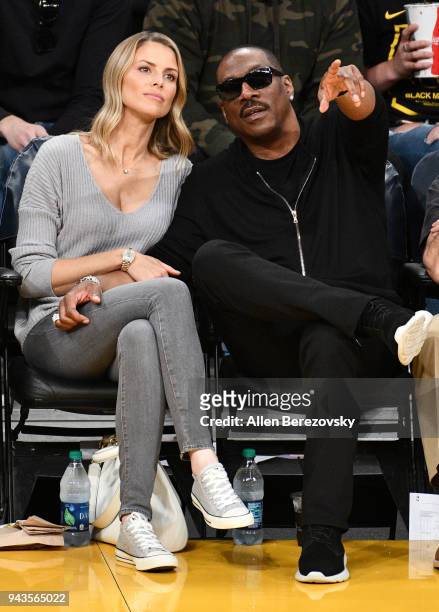 Actor Eddie Murphy and actress Paige Butcher attend a basketball game between the Los Angeles Lakers and the Utah Jazz at Staples Center on April 8,...