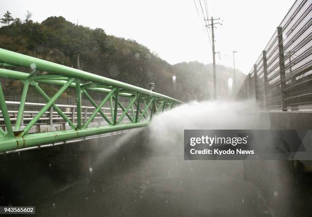 Water spews from a damaged aqueduct bridge in Oda, Shimane Prefecture, after a magnitude 6.1 earthquake hit the western Japan prefecture on the...