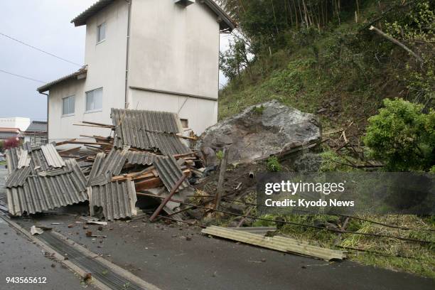 Large rock is seen fallen beside a residential house in Oda, Shimane Prefecture, after a magnitude 6.1 earthquake hit the western Japan prefecture on...