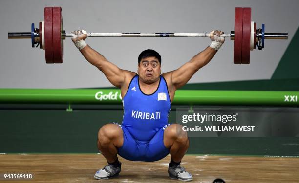 David Katoatau of Kiribati reacts as he lifts during the men's 105kg weightlifting final at the 2018 Gold Coast Commonwealth Games in Gold Coast on...