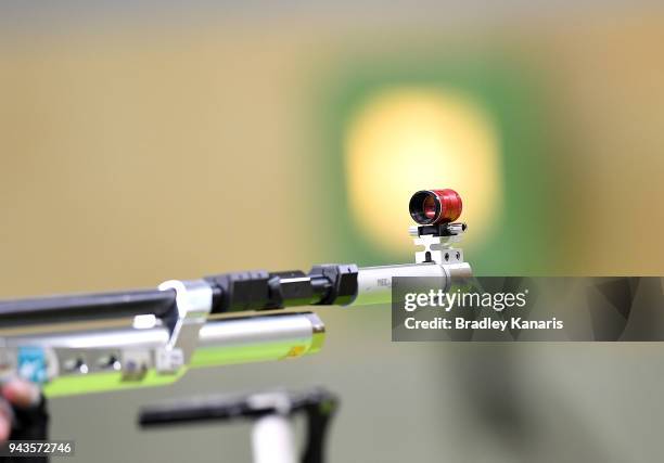 Competitors line up to the target as they prepare to shoot in the final of the Women's 10m Air Rifle event during Shooting on day five of the Gold...