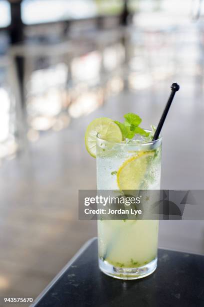 lemon and line juice - lemon juice stock pictures, royalty-free photos & images