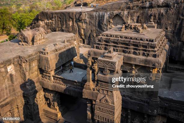 tourists are visiting ellora caves - ellora stock-fotos und bilder