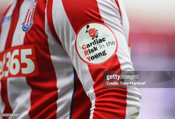 Cardiac Risk in the Young arm badge on a Stoke City palyers shirt during the Premier League match between Stoke City and Tottenham Hotspur at Bet365...