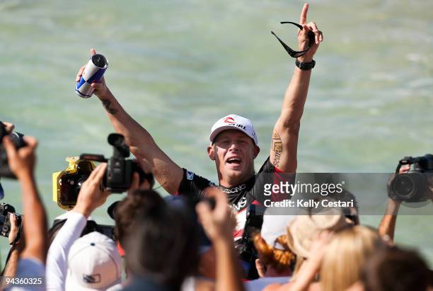Mick Fanning of Australia celebrates his second ASP World Championship Title moments after exiting the water after his Round 4 Billabong Pipeline...
