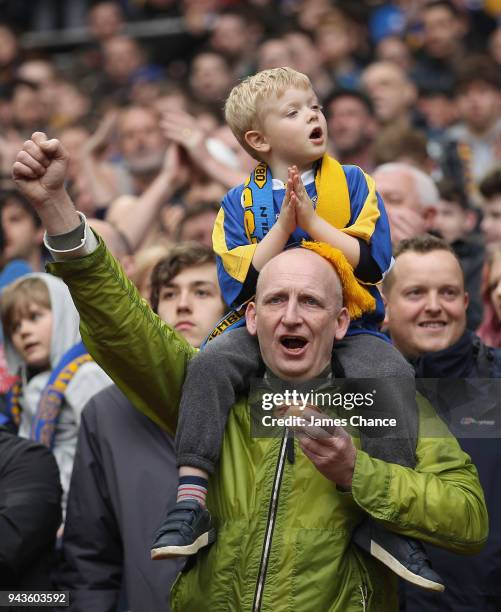 Two Shrewsbury Town fans cheer on their team during the Checkatrade Trophy Final match between Shrewsbury Town and Lincoln City at Wembley Stadium on...