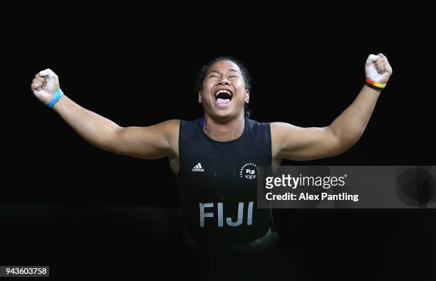 Eileen Cikamatana of Fiji celebrates in the Women's 90/+90kg Final during Weightlifting on day five of the Gold Coast 2018 Commonwealth Games at...