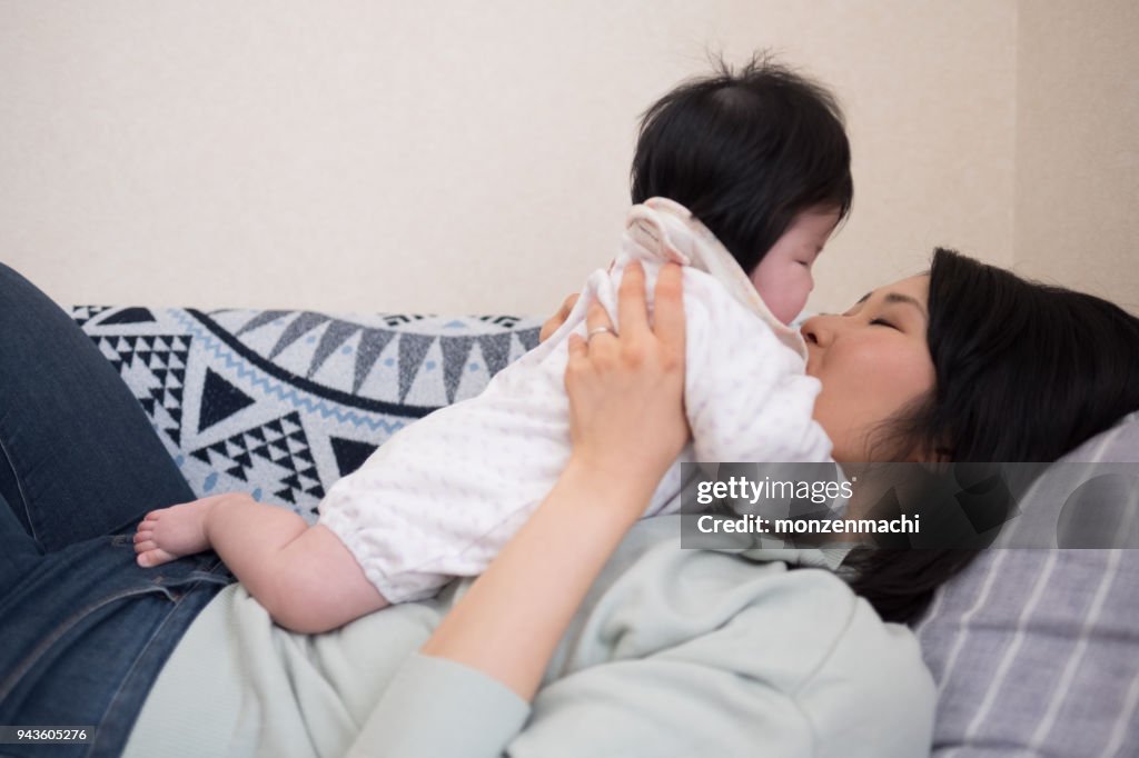 Mother embracing baby