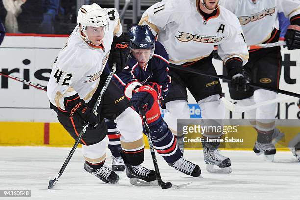 Jakub Voracek of the Columbus Blue Jackets poke checks the puck away from Dan Sexton of the Anaheim Ducks during the second period on December 12,...