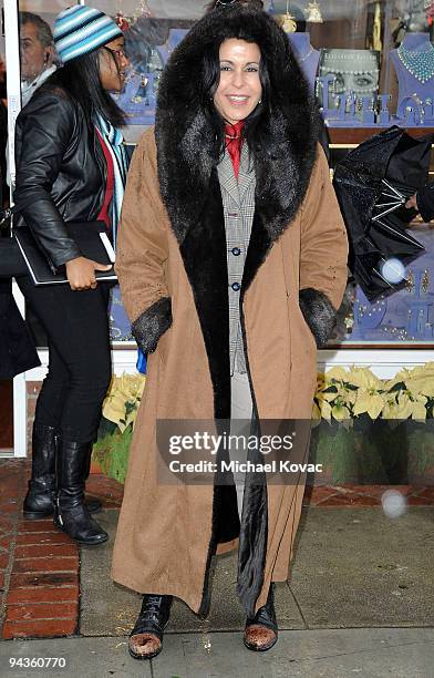 Actress Maria Conchita Alonso braves the rain to attend the House Of Taylor Grand Opening at Luxury Jewels of Beverly Hills on December 12, 2009 in...