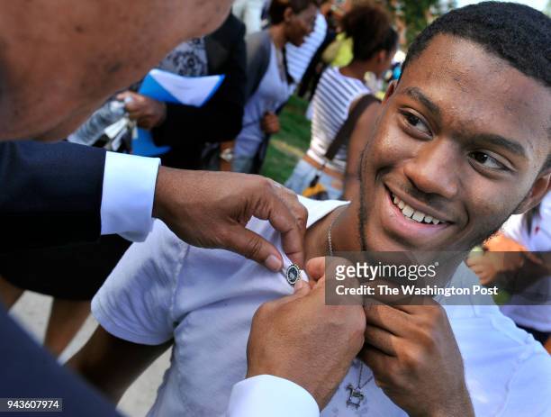 Howard University president Sidney A. Ribeau pinned freshman Tyrone Hankerson from Atlanta, GA. During the pinning ceremony on August 16, 2011 in...