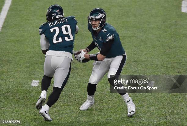 Nick Foles of the Philadelphia Eagles fakes the hand off to LeGarrette Blount against the New England Patriots during Super Bowl LII at U.S. Bank...