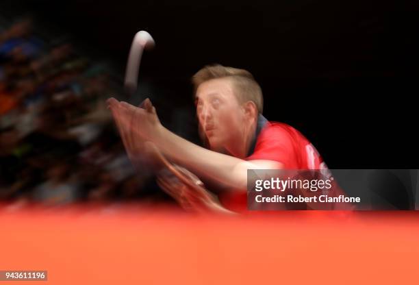 Liam Pitchford of England competes against S.F.E.Poh of Singapore during the Men's Team Table Tennis Bronze Medal Match on day five of the Gold Coast...