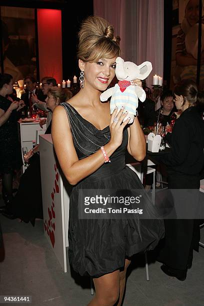 Verona Pooth poses with elephant at the 'Ein Herz fuer Kinder' Gala at Studio 20 at Adlershof on December 12, 2009 in Berlin, Germany.