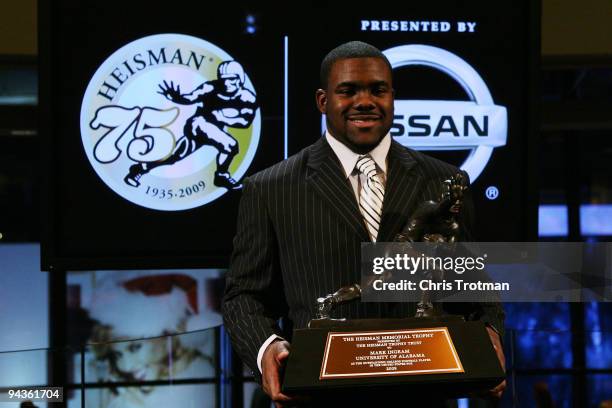 Running back Mark Ingram of the Alabama Crimson Tide poses with the Heisman Trophy during a press conference after being named the 75th Heisman...