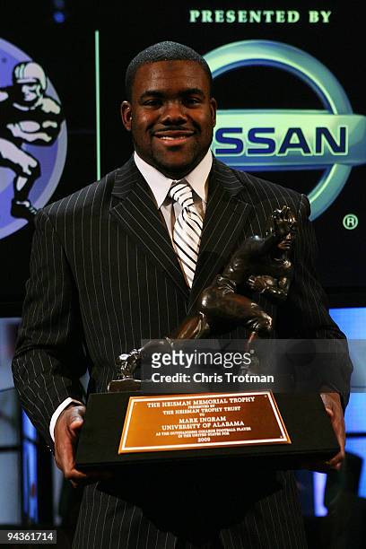 Running back Mark Ingram of the Alabama Crimson Tide poses with the Heisman Trophy during a press conference after being named the 75th Heisman...