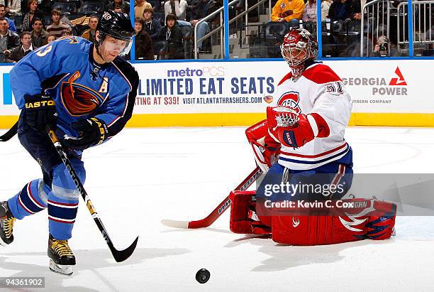 Goaltender Carey Price of the Montreal Canadiens saves a shot on goal in front of Slava Kozlov of the Atlanta Thrashers at Philips Arena on December...