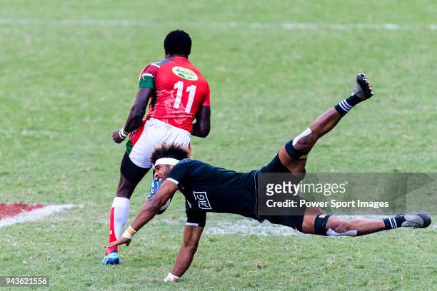 Luke Masirewa of New Zealand tries to tackle Collins Injera of Kenya during the HSBC Hong Kong Sevens 2018 Semi-Finals match between Kenya and New...