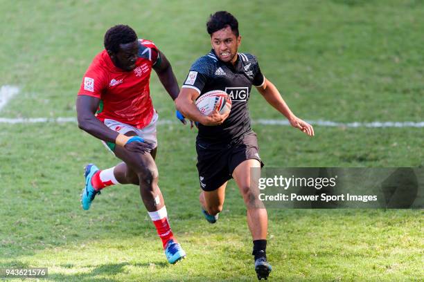 Oscar Ouma of Kenya tries to put a tackle on Rocky Khan of New Zealand during the HSBC Hong Kong Sevens 2018 Semi-Finals match between Kenya and New...