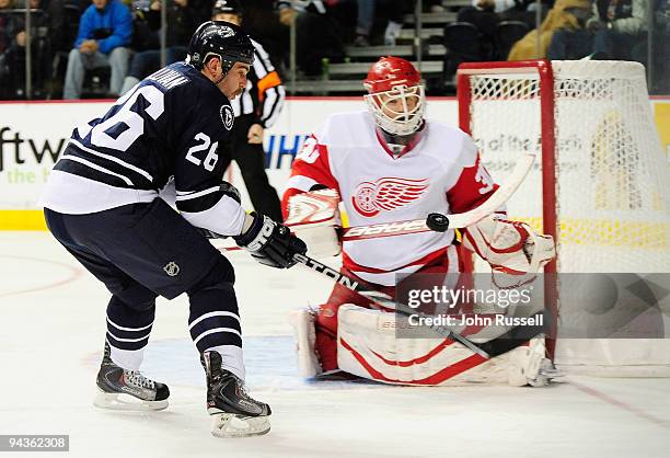 Steve Sullivan of the Nashville Predators has his shot blocked by Chris Osgood of the Detroit Red Wings on December 12, 2009 at the Nashville Arena...