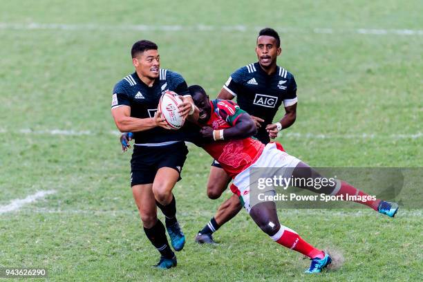 Jeffery Oluoch of Kenya tackles Tone Ng Shiu of New Zealand during the HSBC Hong Kong Sevens 2018 Semi-Finals match between Kenya and New Zealand on...