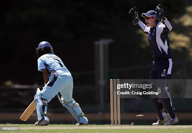 Lisa Sthalekar of the Breakers is bowled by Kristen Beams of the Spirit during the WNCL match between the New South Wales Breakers and the Victoria...