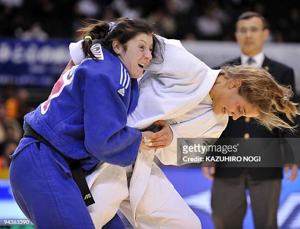 Belgium's Julie Baeyens tries to throws Rumania's Corina Caprioriu during the women's 57kg class second round match at the Tokyo Grand Slam judo...