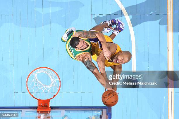 Deron Williams of the Utah Jazz blocks the shot of Derek Fisher of the Los Angeles Lakers at EnergySolutions Arena on December 12, 2009 in Salt Lake...