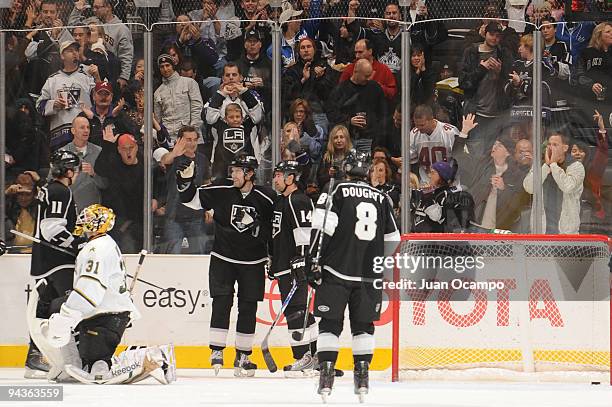 Alexander Frolov of the Los Angeles Kings celebrates with teammates Anze Kopitar, Justin Williams and Drew Doughty after scoring a goal against Alex...