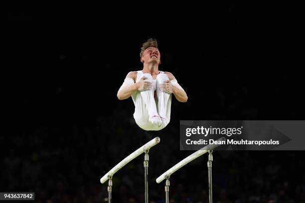 Nile Wilson of England competes in the Men's Parallel Bars Final during Gymnastics on day five of the Gold Coast 2018 Commonwealth Games at Coomera...