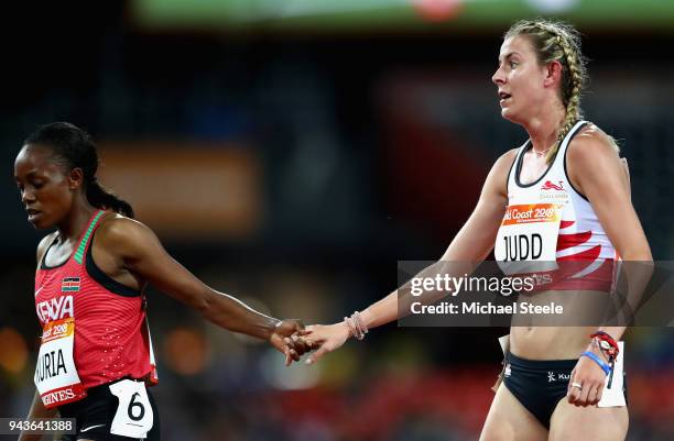 Jessica Judd of England and Mary Wangari Kuria of Kenya shake hands after the Women's 1500 metres heats during the Athletics on day five of the Gold...