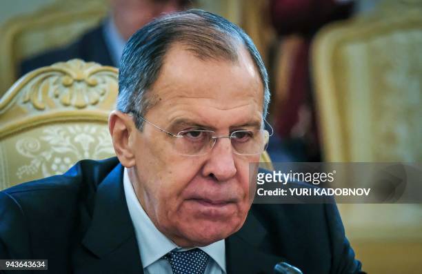 Russian Foreign Minister Sergei Lavrov speaks with his Tajik counterpart during their meeting in Moscow on April 9, 2018. The Russian army onApril 9,...