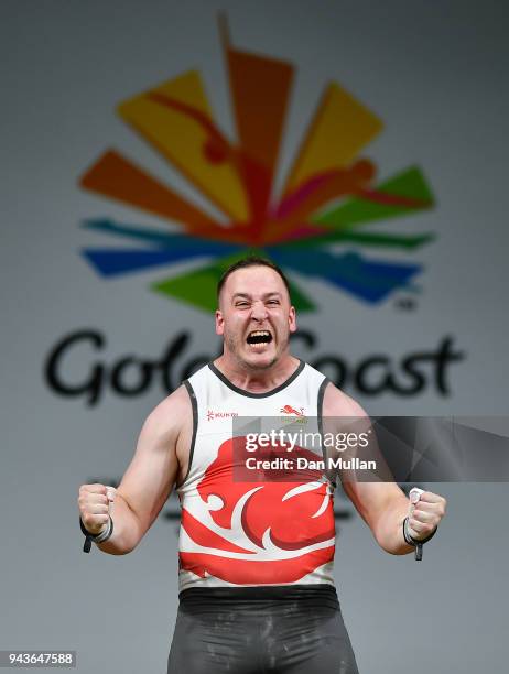 Benjamin Watson of England celebrates completing a lift in the Men's +105kg Final during the Weightlifting on day five of the Gold Coast 2018...