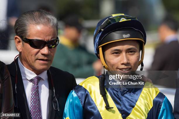 Jockey Matthew Poon Ming-fai and trainer Tony Cruz celebrate after Jolly Gene winning Race 6 Dongcheng District Handicap at Sha Tin racecourse on...