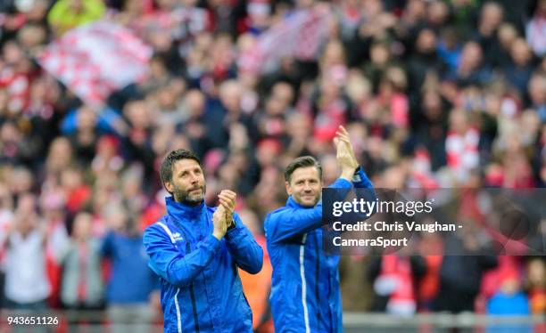 Lincoln City manager Danny Cowley, left, and Lincoln City's assistant manager Nicky Cowley applaud the fans at the end of the Checkatrade Trophy...