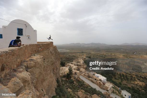 Parkour athlete Taher Nouiri performs a flip in Takrouna village of Sousse, Tunisia on April 08, 2018.