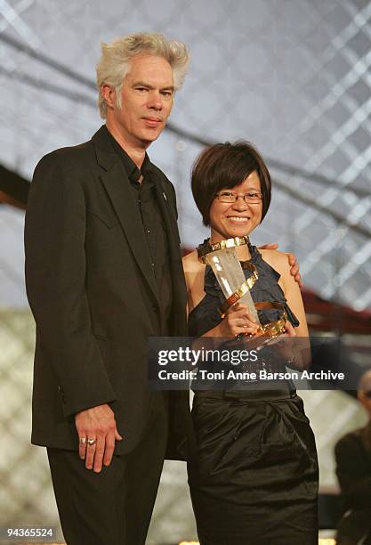 Jim Jarmusch presents an award to Charlotte Lim Lay Kuen during the Closing Ceremony for the Marrakech 9th Film Festival at the Mansour Hotel -...